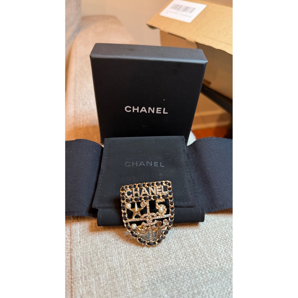 Chanel B21V Shield Brooch Gold Tone Crystal Pearl Leather Chain Crest Pin